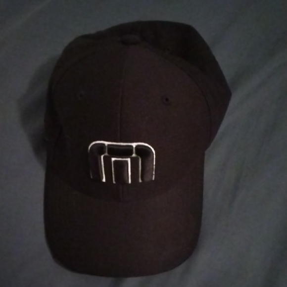 Travis Mathew Black Hat with Silver Logo - Picture 1 of 3